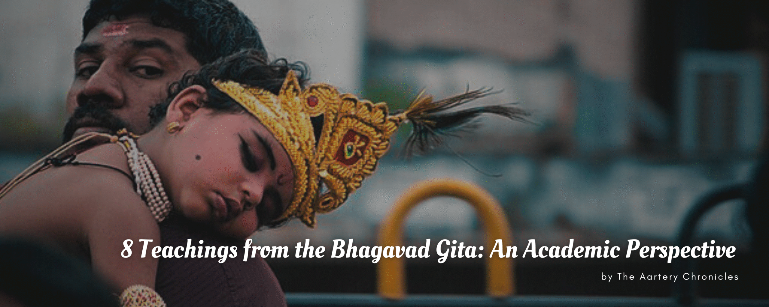 A father carries his child dressed as Lord Krishna, wearing a golden crown with a peacock feather, jewelry, and traditional makeup.